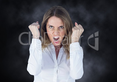 Angry business woman against mist