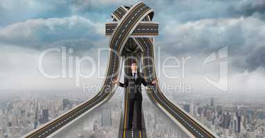 Digital composite image of confused businessman standing on 3d jumbled highway