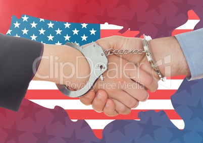 people shaking their hands with handcuff against american flag
