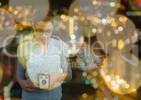 photographer taking a photo with vintage camera. Blurred city lights background and yellow blurred l
