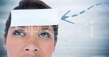 Woman with blue 3D arrow pointing to card on head against blurry blue wood panel