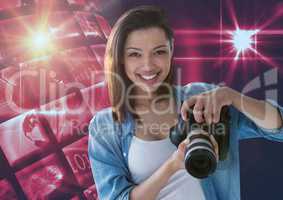 Photographer holding a camera against disco ball