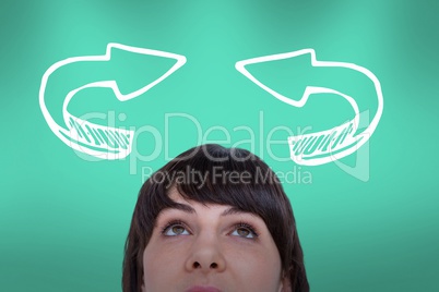 Woman looking upwards with arrows above her heads