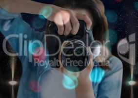 photographer foreground taking a photo with reflex camera. Blurred  blue and red lights overlap and
