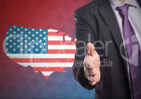 Part of a man offering his hand  with american flag in background