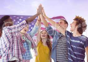 Friends high fiving  against american flag