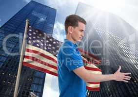 man shaking his hand against american flag and skyscapers