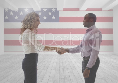 Business people shaking their hands against american flag