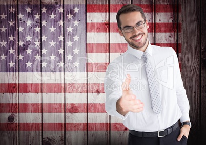 Smiling businessman offering his hand for independence day