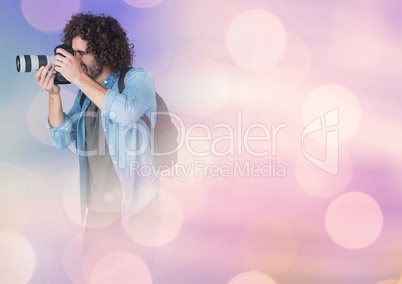 Photographer taking pictures against glowing background