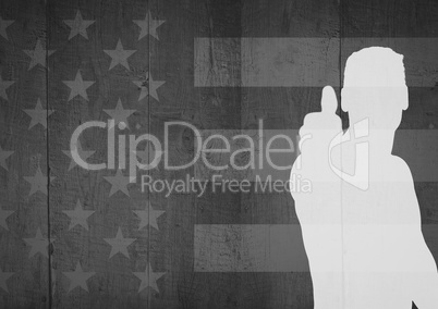 Silhouette of man with thumb up agaimnst black and white american flag