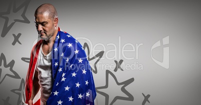 Man wrapped in american flag looking down against grey background with hand drawn star pattern