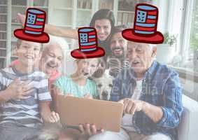 Composite image of a family watching at the digital tablet with 4th of july hats
