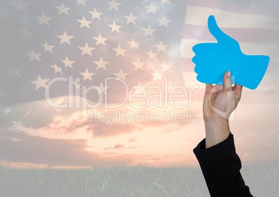 Business man hand holding a thumb up against american flag