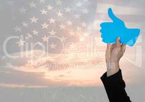 Business man hand holding a thumb up against american flag