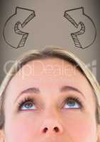 Top of woman's head looking up at brown 3D arrows against brown background