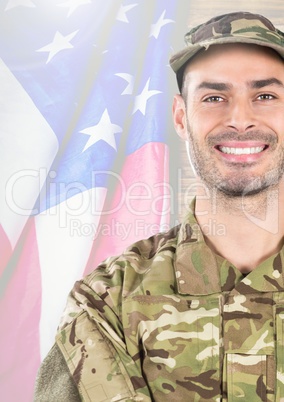 Smiling soldier in front of american flag
