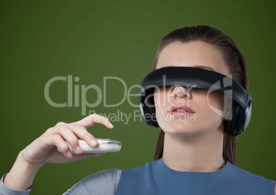 Woman in virtual reality headset against green background