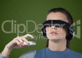 Woman in virtual reality headset against green background