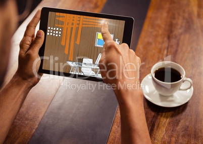 hands with tablet in a coffee shop. Tablet with office lines (brown, orange, blue and yellow)