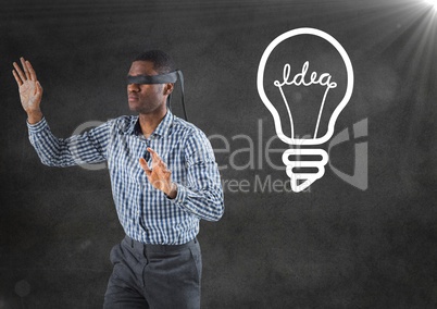 Blindfolded business man against grey wall with flare and white lightbulb graphic