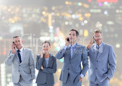 Business people calling in city background
