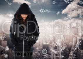 Woman hacker hooded standing on in front of digital background