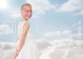 Girl with pink facepaint against sky with flare