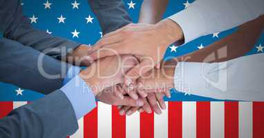 Business people with hands together against american flag