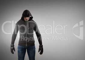 Hacker with black jacket in front of grey background