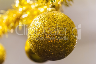 Shiny golden ball for Christmas tree decoration