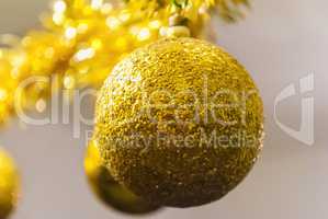 Shiny golden ball for Christmas tree decoration