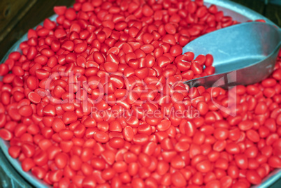 close up of red sugar candies