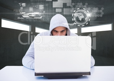 Hacker using a laptop in a dark room