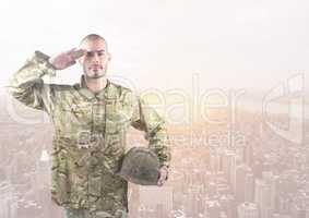 Soldier with hand in head in front of city buildings