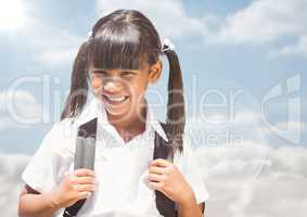 Schoolgirl against sky with flare