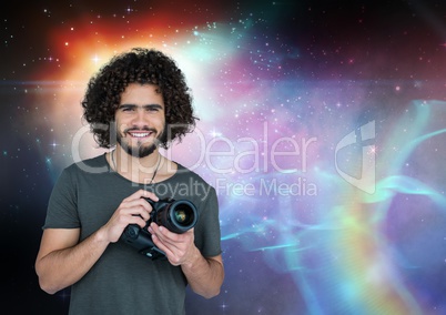 Photographer holding a camera against galaxy background