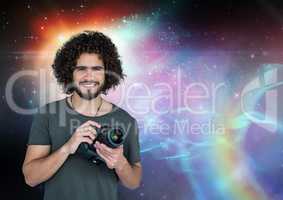 Photographer holding a camera against galaxy background
