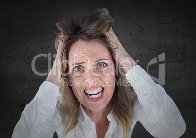 Frustrated business woman against grey wall and math graphics