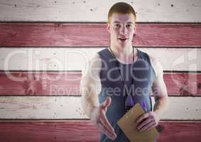 Smiling man offering his hand against wooden red and white  background