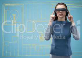 Woman in virtual reality headset against yellow and blue hand drawn wall with pictures