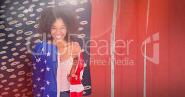 Smiling woman wearing an american flag on her shoulders