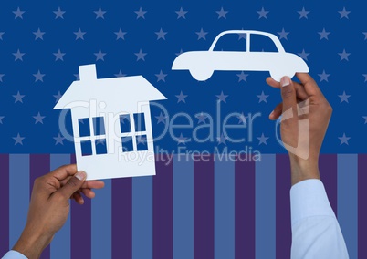 Hand holding a paper house and paper car against american flag