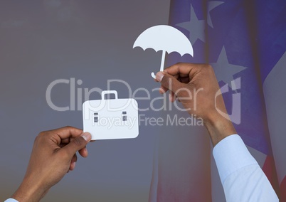 Business man hand holding an umbrella and a suitcase on paper against american flag