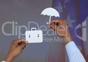 Business man hand holding an umbrella and a suitcase on paper against american flag