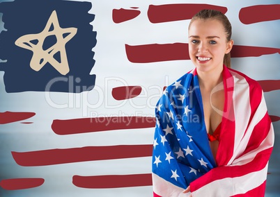 Woman wrapped in american flag against hand drawn american flag and blurry blue background