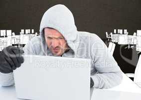 Hacker working on laptop in front of office drawing background