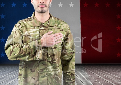 Military with hand on his heart against french flag