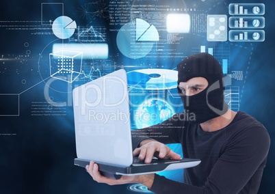 Hacker using a laptop in front of digital background