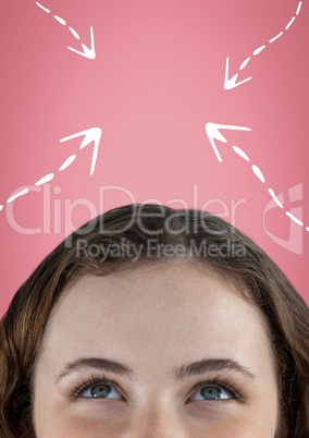 Woman looking up at white arrows against pink background